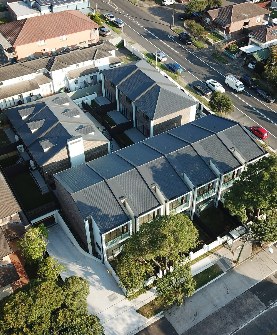 Aerial view of townhouses at dusk