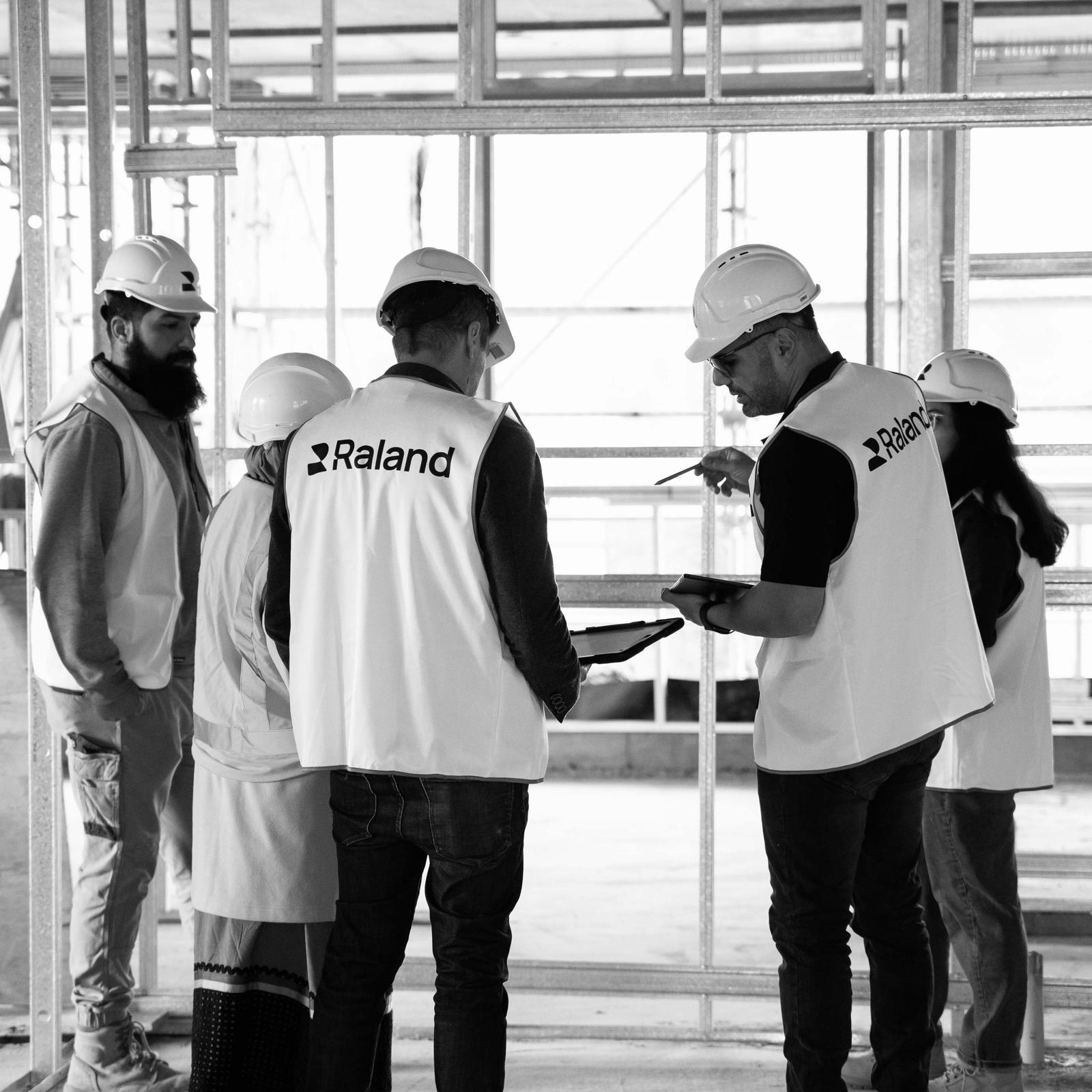 Raland site team reviewing drawings